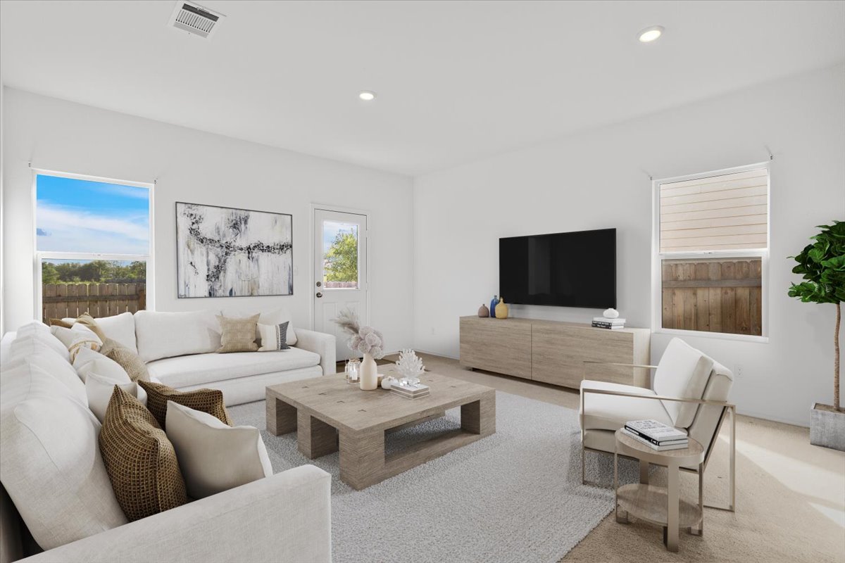 14320 Tordillo Drive Elgin, TX 78621 - Photo 4 of 19 Carpeted living area featuring recessed lighting