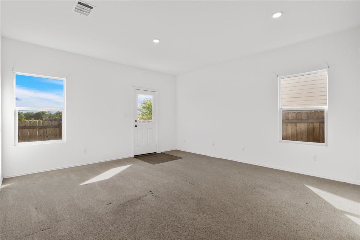 14320 Tordillo Drive Elgin, TX 78621 - Photo 10 of 19 Carpeted spare room with recessed lighting