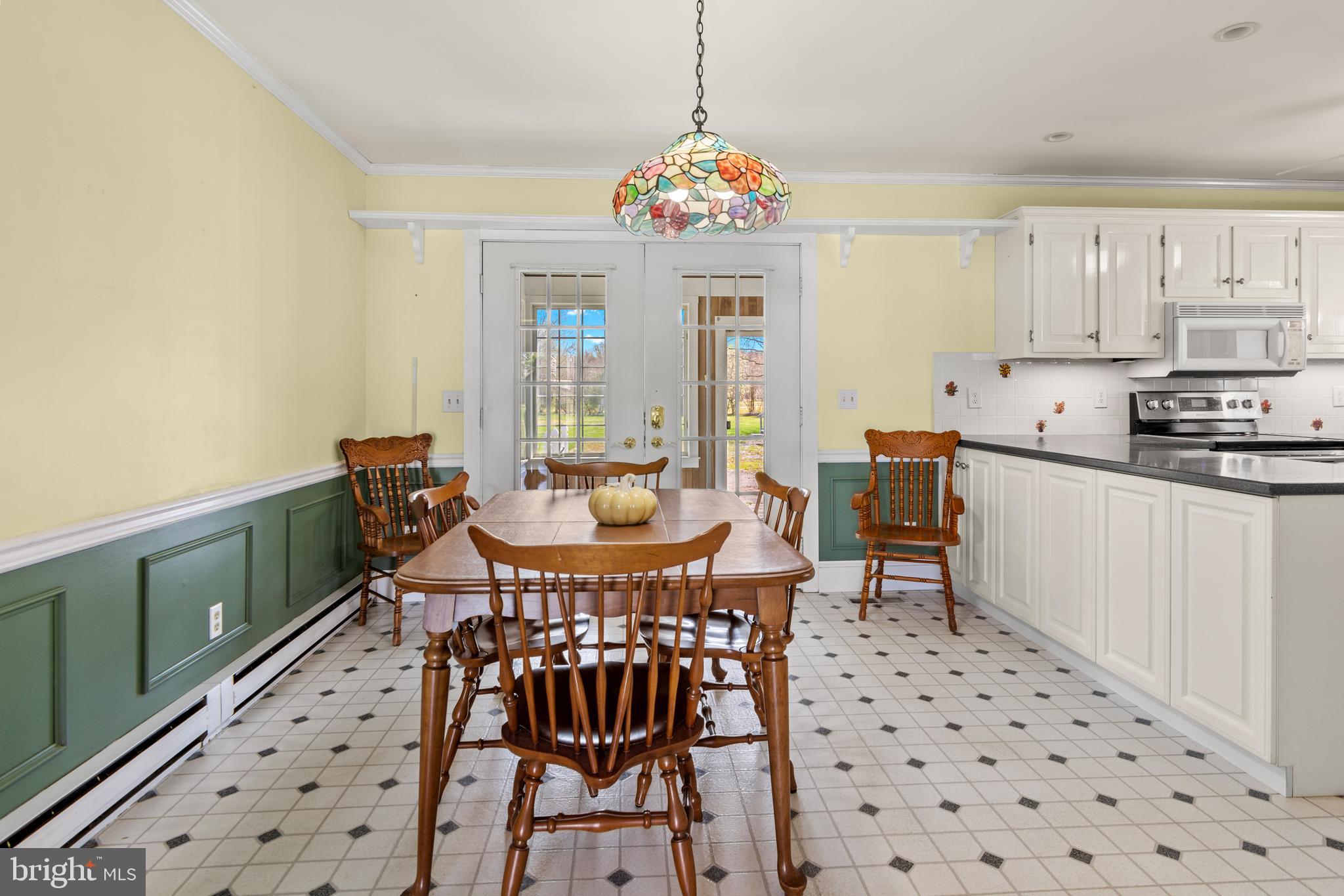 22539 Indian Point Road Bozman, MD 21612 - Photo 14 of 66 a view of a dining room with furniture and chandelier