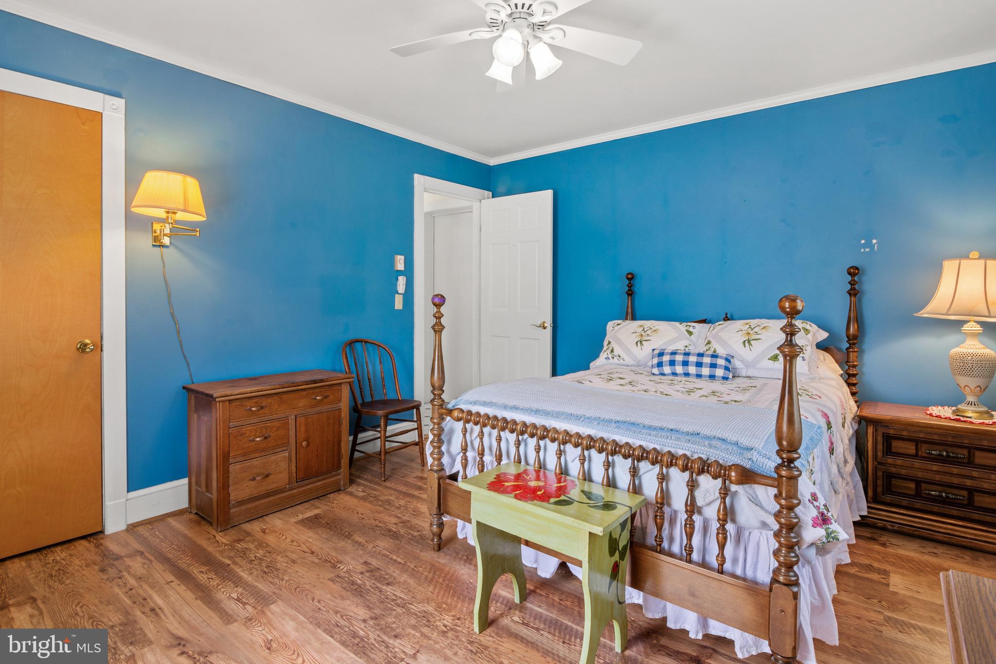 22539 Indian Point Road Bozman, MD 21612 - Photo 27 of 66 a bedroom with a bed and wooden floor