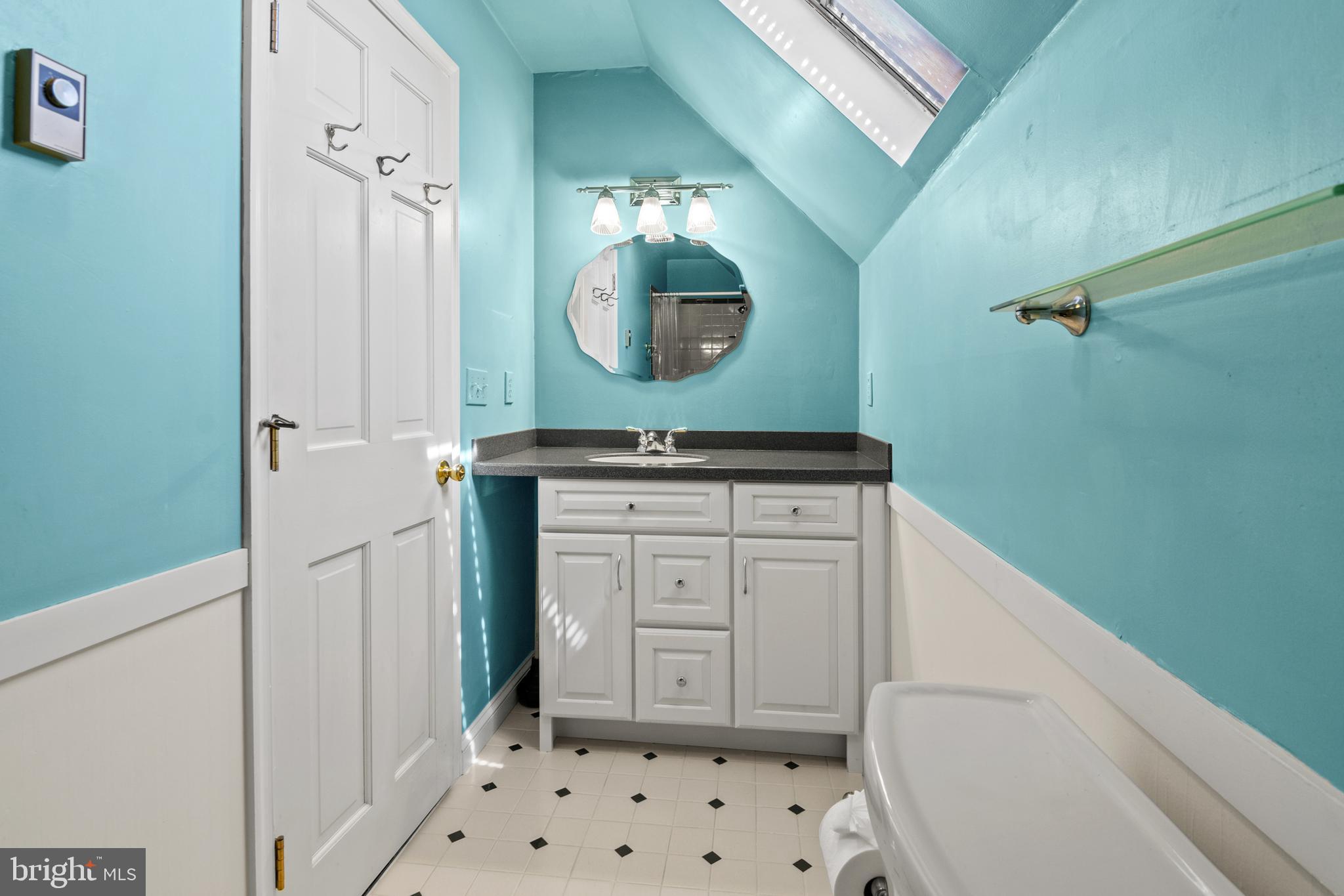 22539 Indian Point Road Bozman, MD 21612 - Photo 33 of 66 a bathroom with a sink a vanity and a mirror