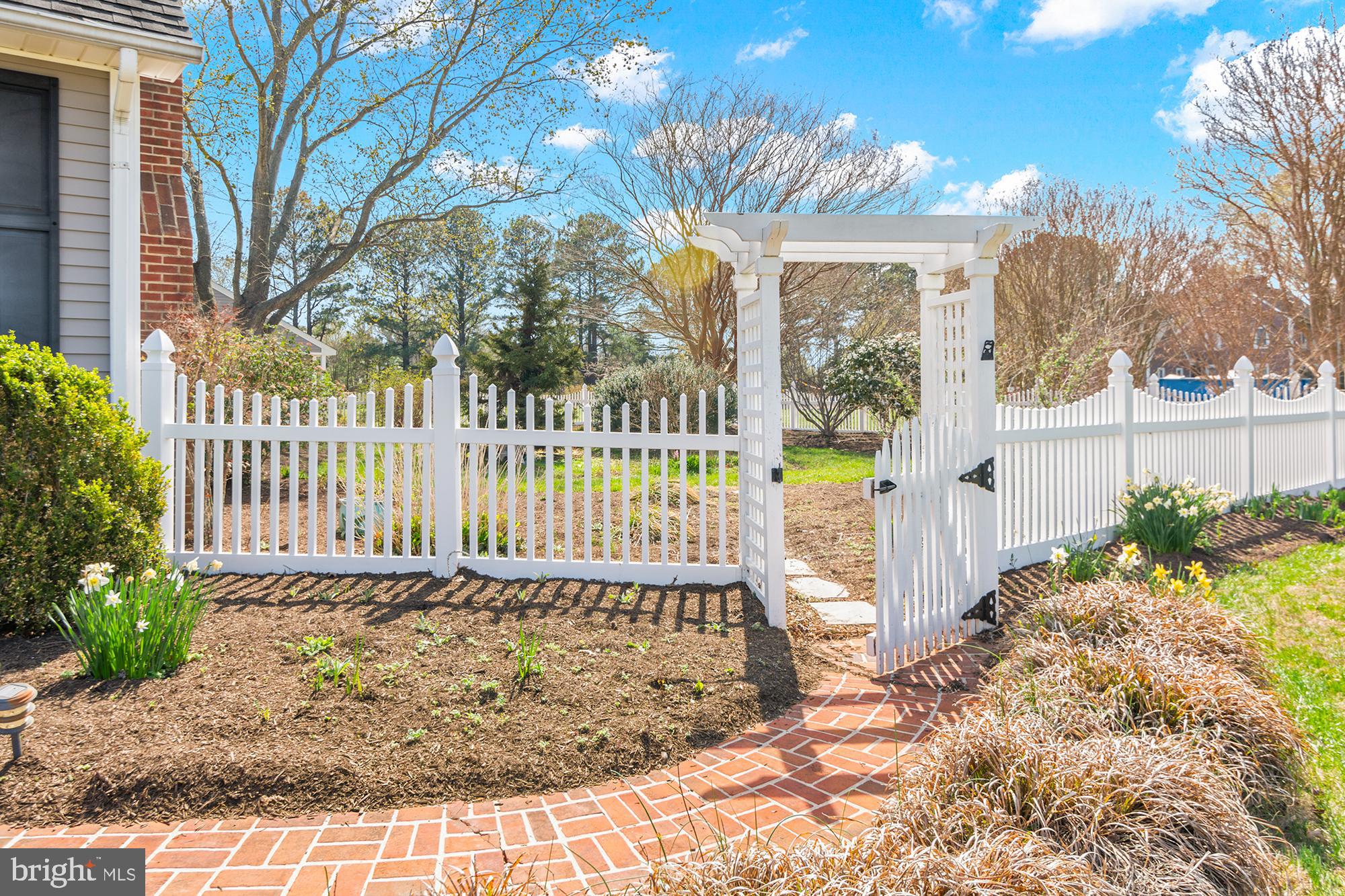 22539 Indian Point Road Bozman, MD 21612 - Photo 5 of 66 a view of a pathway of a house with a small yard