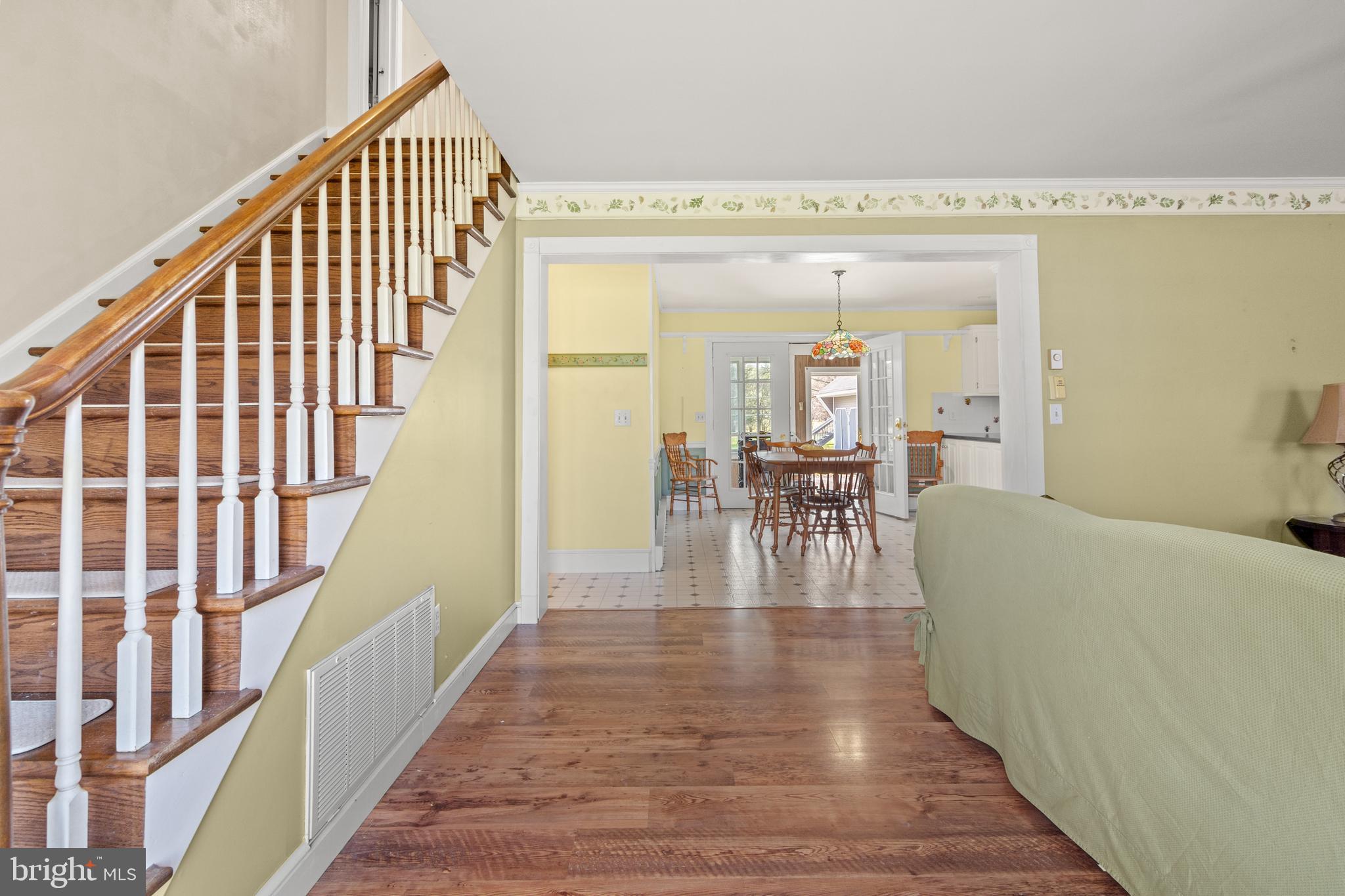 22539 Indian Point Road Bozman, MD 21612 - Photo 7 of 66 a view of a hallway with wooden floor and staircase
