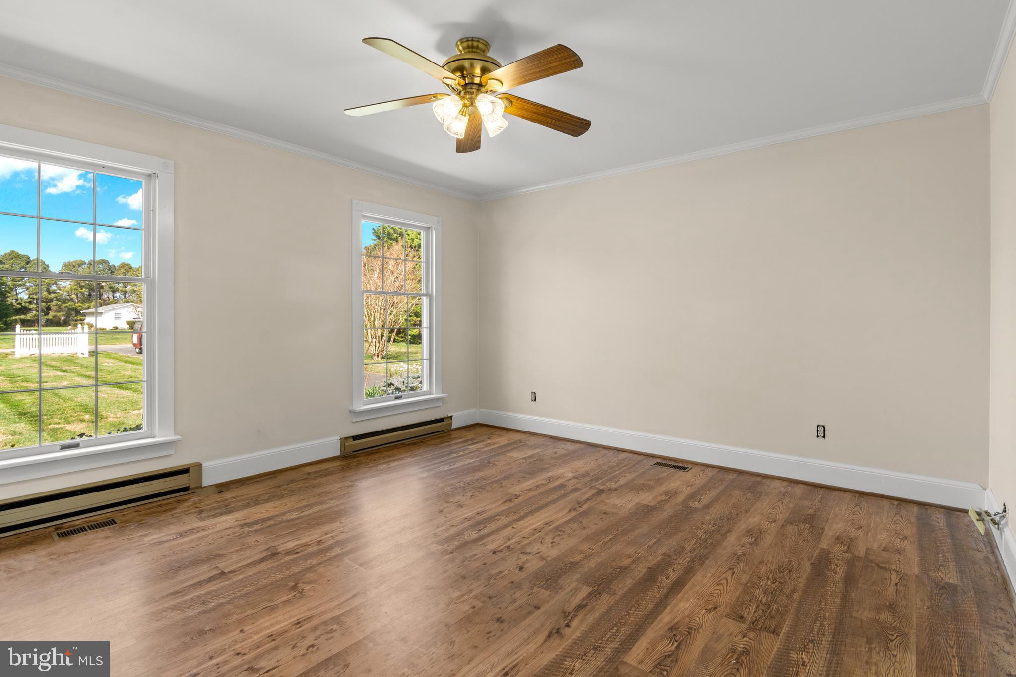 22539 Indian Point Road Bozman, MD 21612 - Photo 8 of 66 wooden floor in an empty room with a window