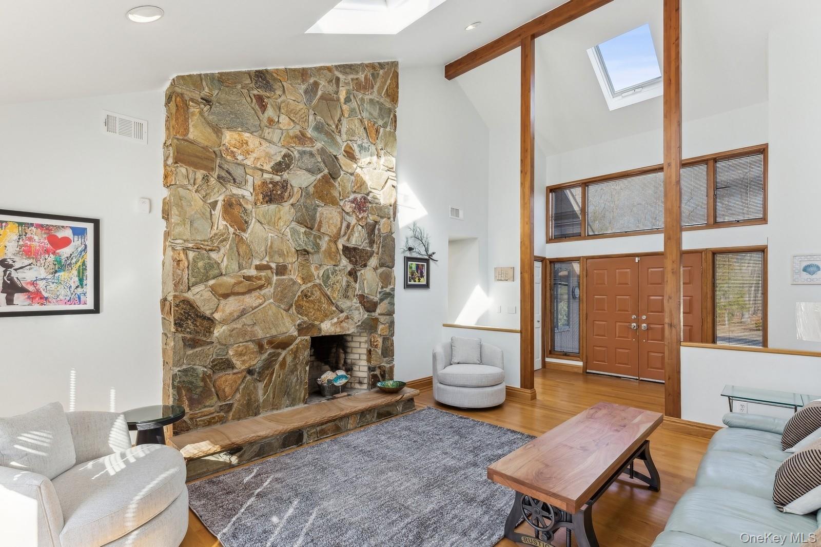 2905 Private Road East Marion, NY 11939 - Photo 4 of 32 Living Room with Vaulted Ceiling and Fireplace - Photo 1