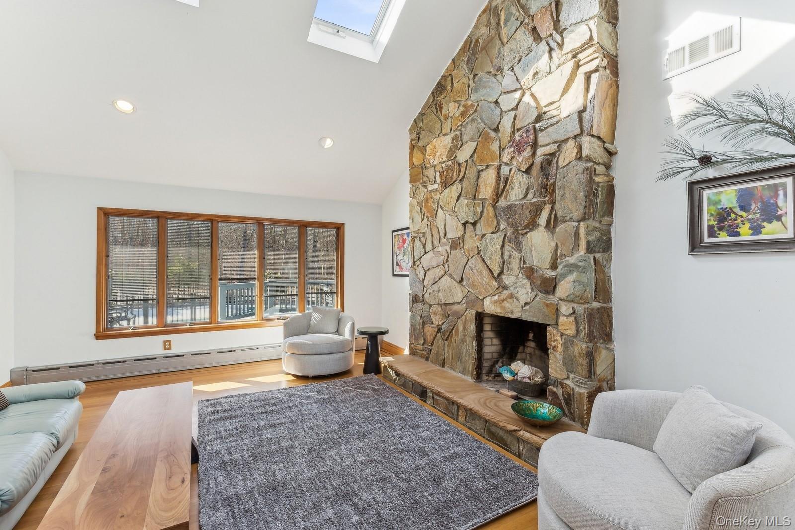 2905 Private Road East Marion, NY 11939 - Photo 5 of 32 Living Room with Vaulted Ceiling and Fireplace - Photo 2