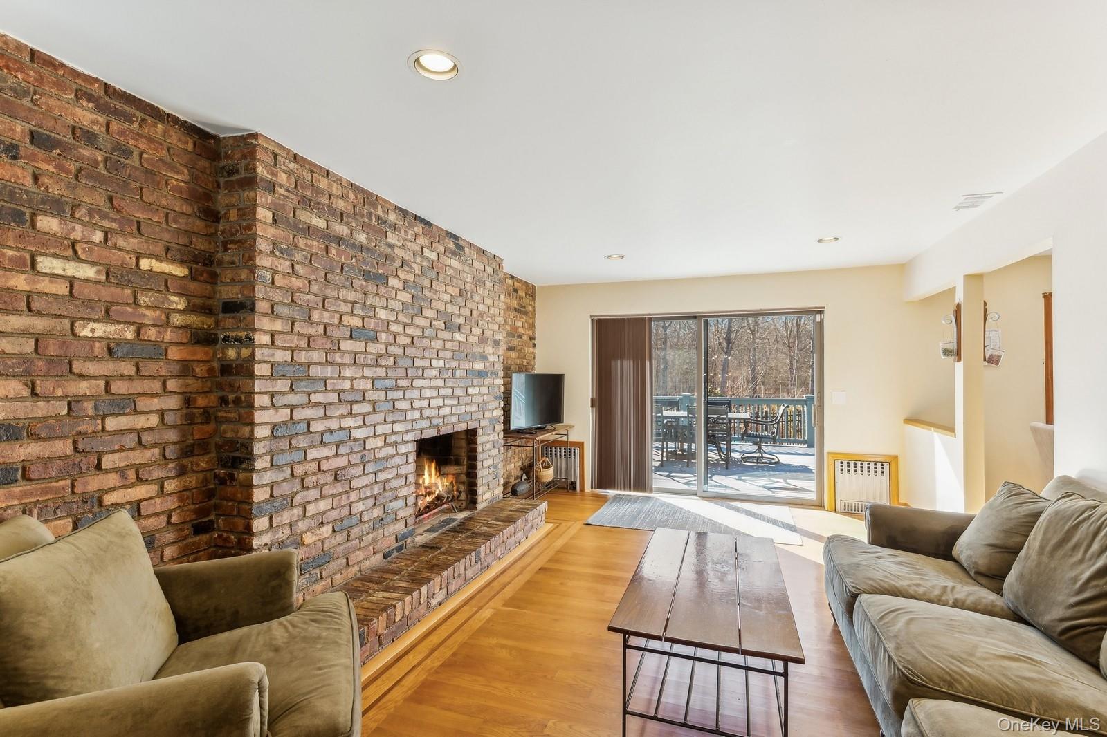 2905 Private Road East Marion, NY 11939 - Photo 6 of 32 Family Room with Fireplace, Off Kitchen - Photo 1