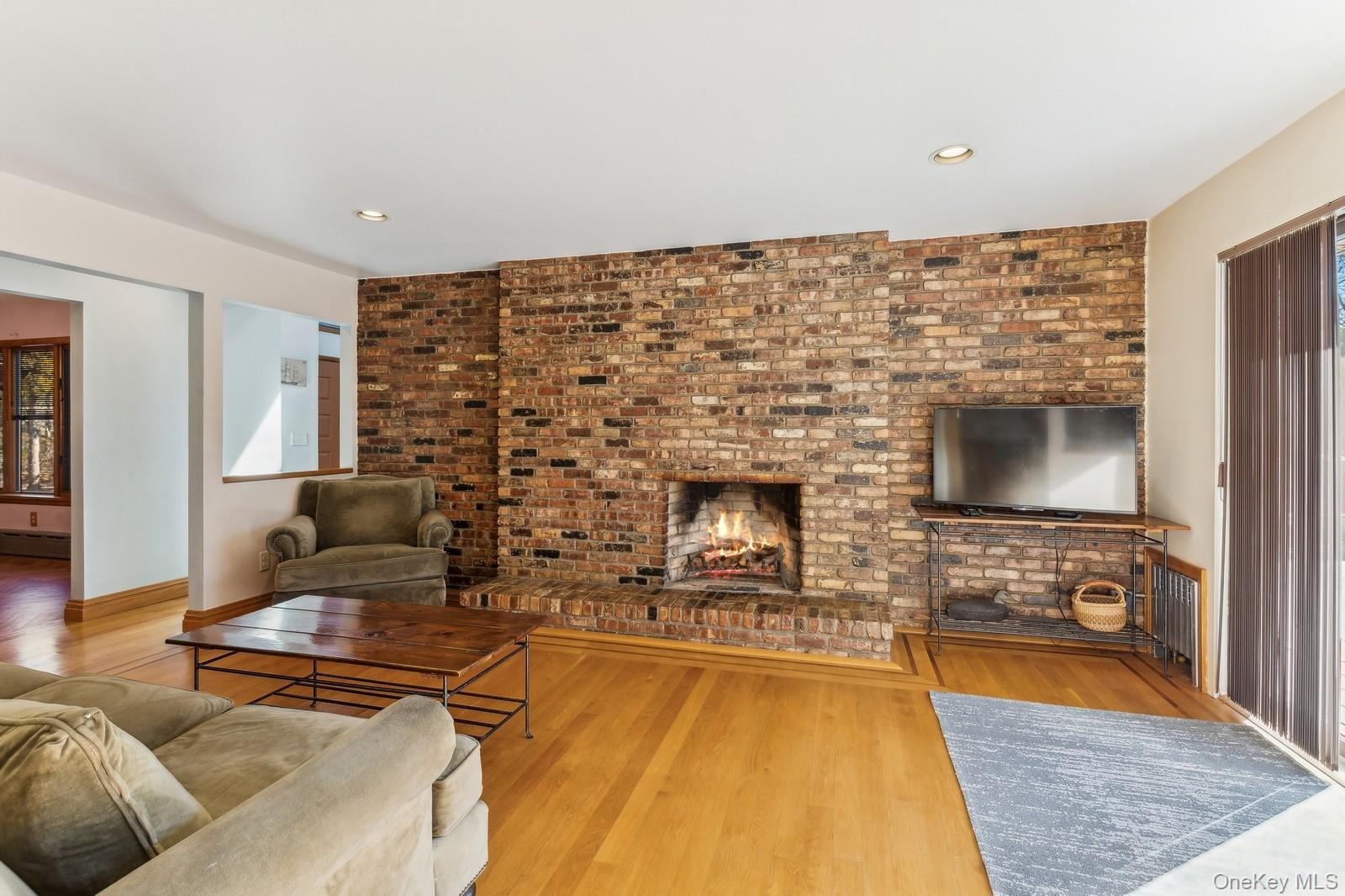 2905 Private Road East Marion, NY 11939 - Photo 7 of 32 Family Room with Fireplace, Off Kitchen - Photo 2