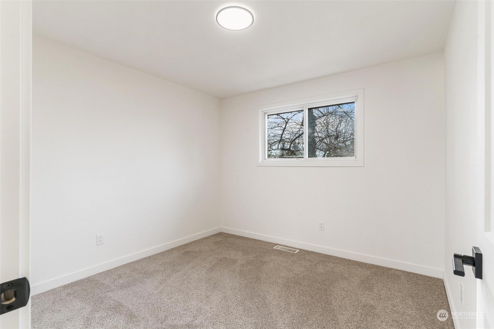 302 225th Street Southwest Bothell, WA 98021 - Photo 17 of 39 an empty room with a window