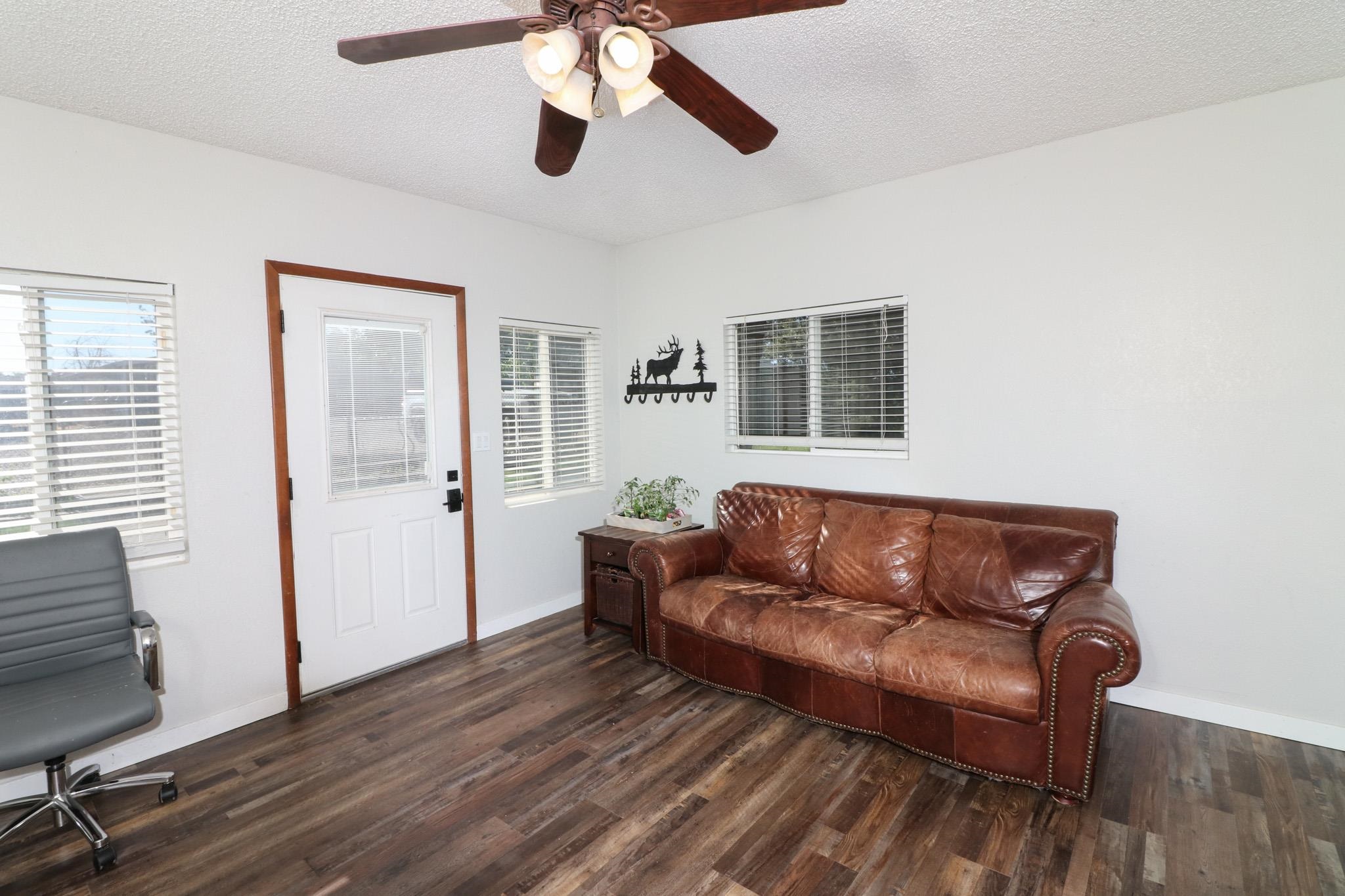 607-28 28 3/4 Road Grand Junction, CO 81506 - Photo 22 of 42 a living room with furniture and a flat screen tv