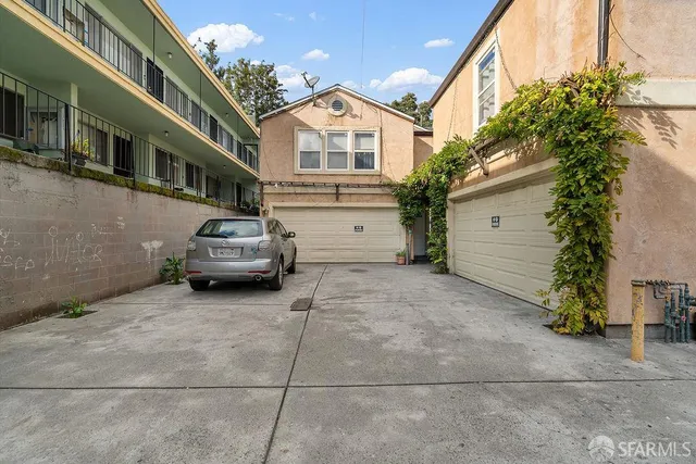 a view of a car park in front of house