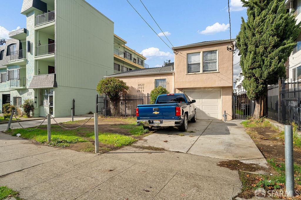 2825 High Street Oakland, CA 94619 - Photo 7 of 23 a car parked in front of a house