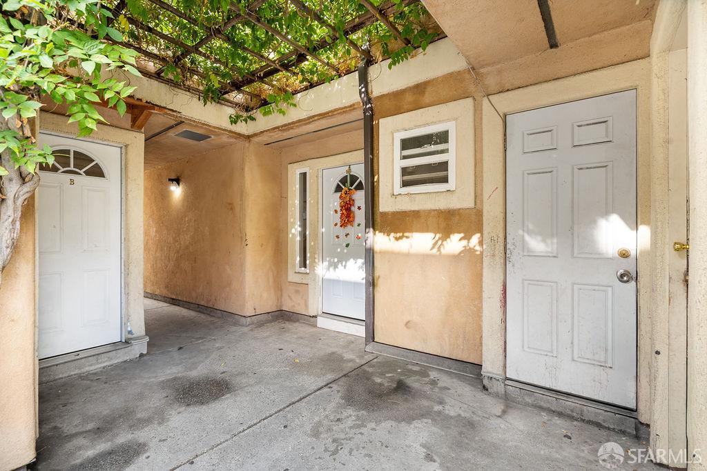 2825 High Street Oakland, CA 94619 - Photo 9 of 23 a view of a hallway with wooden shelves