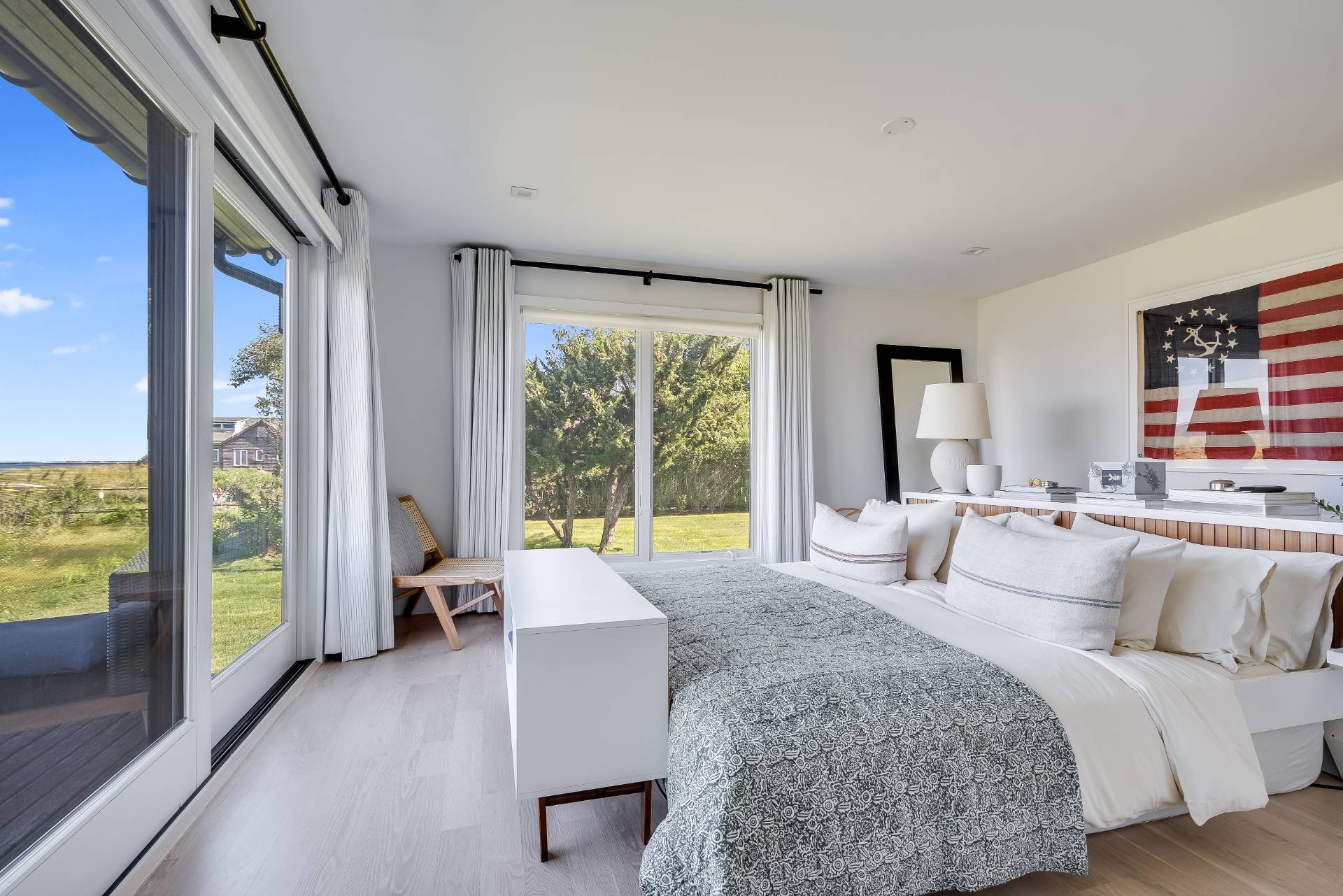 101 Gerard Drive East Hampton, NY 11937 - Photo 14 of 29 a spacious bedroom with a large bed and a large window