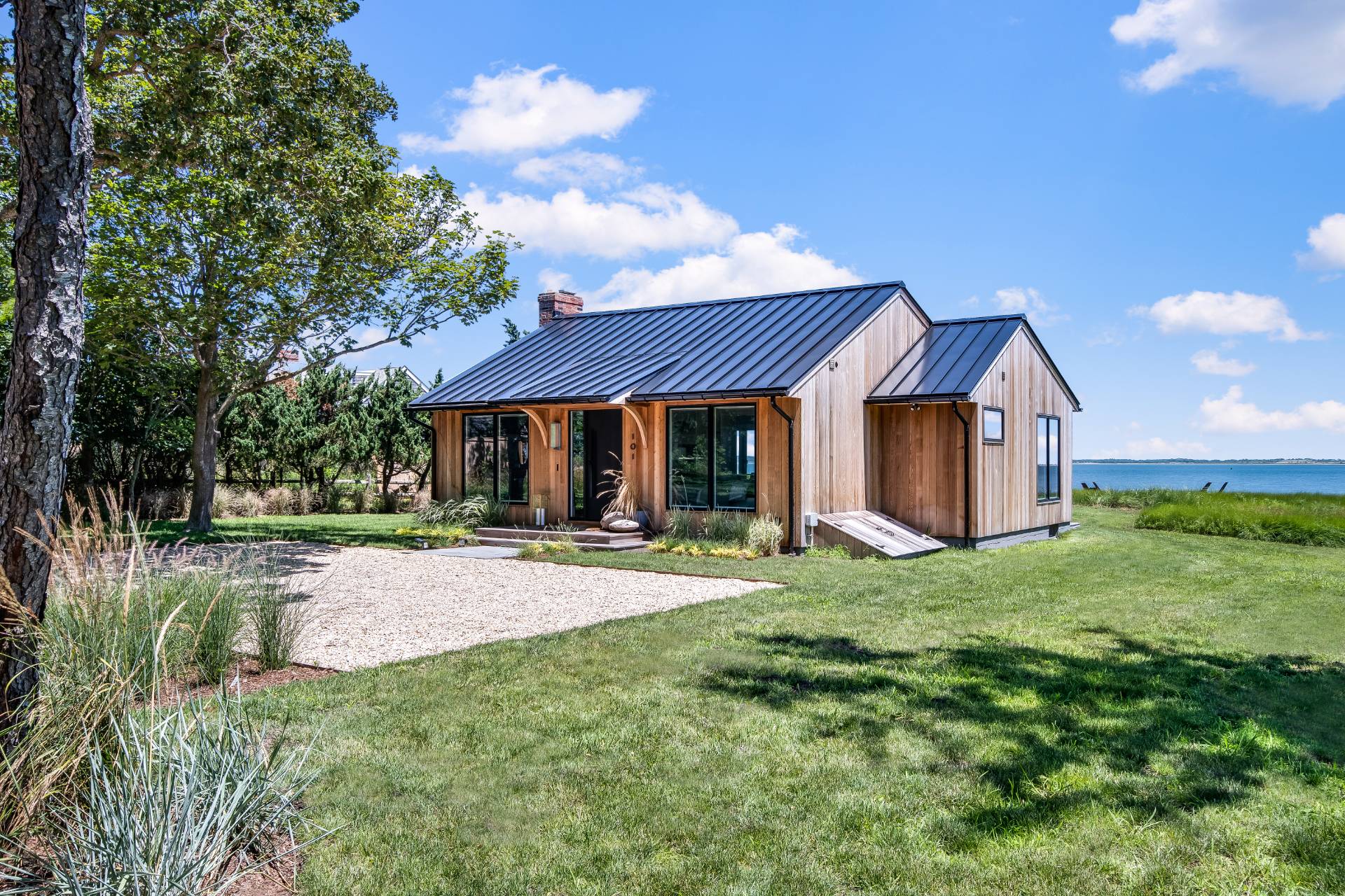 101 Gerard Drive East Hampton, NY 11937 - Photo 2 of 29 a view of a house with backyard and garden
