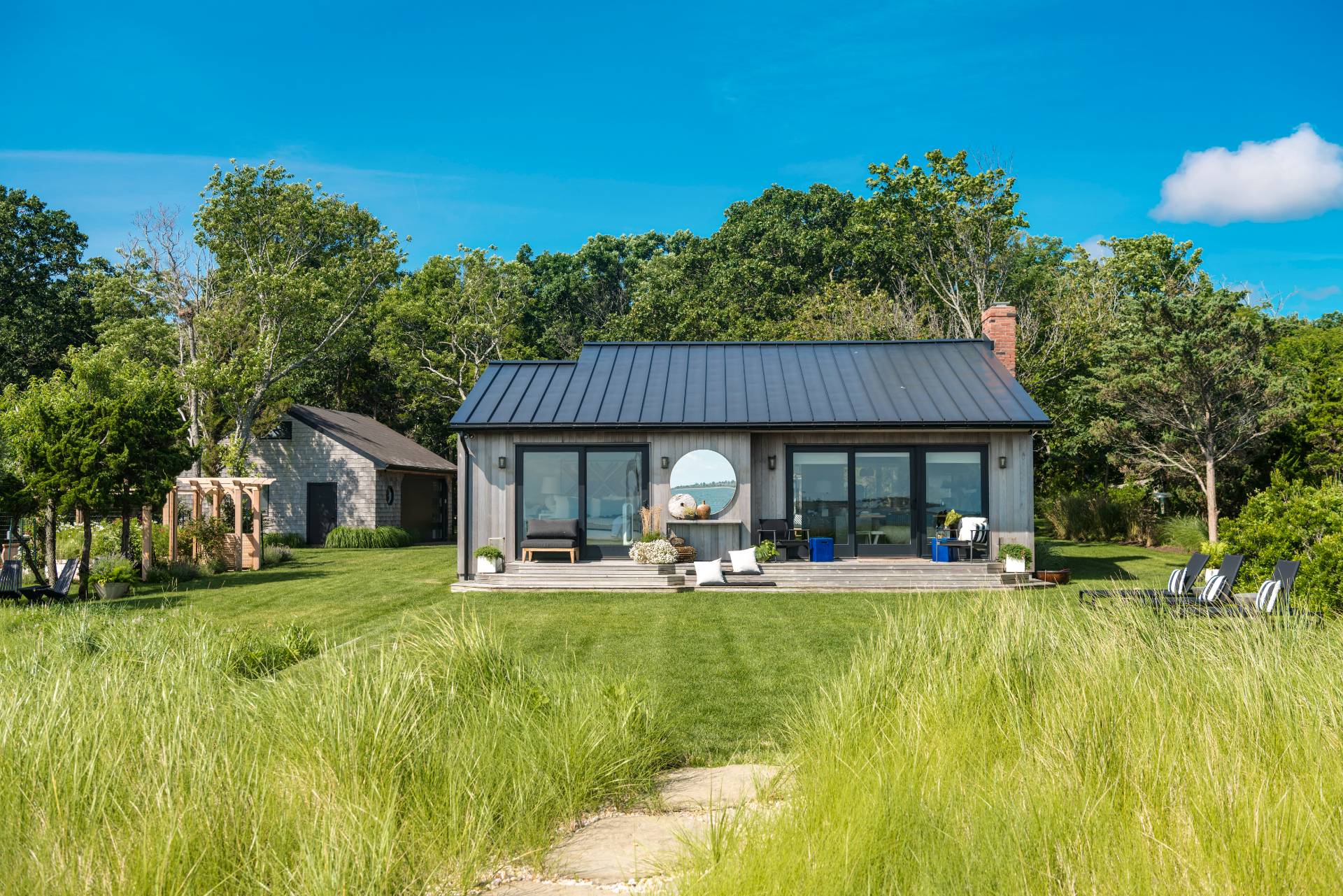 101 Gerard Drive East Hampton, NY 11937 - Photo 4 of 29 a house view with swimming pool and garden space