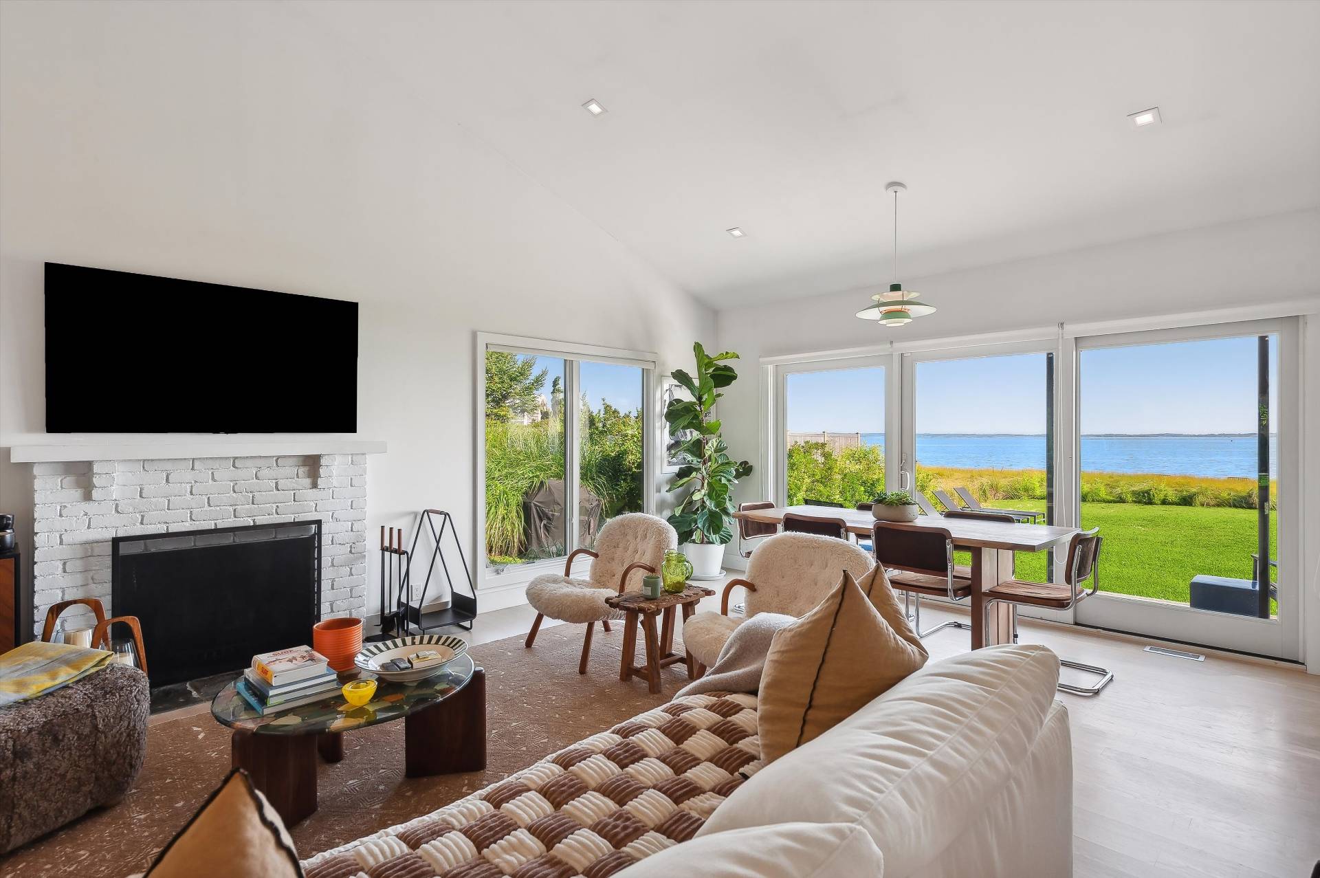 101 Gerard Drive East Hampton, NY 11937 - Photo 9 of 29 a living room with fireplace furniture and a flat screen tv