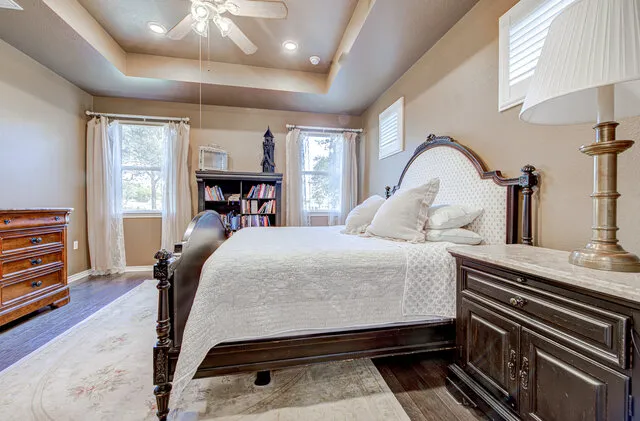 a bed room with a bed and dresser