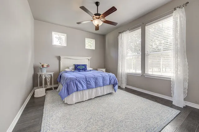 a bedroom with a bed and window