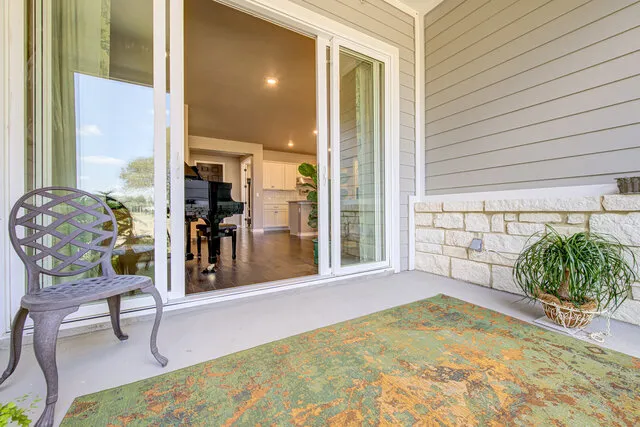 a view of a porch with seating space