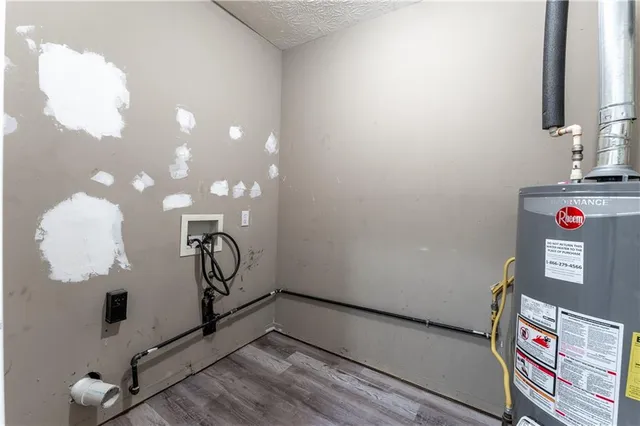 a room with gym equipment and view of living room