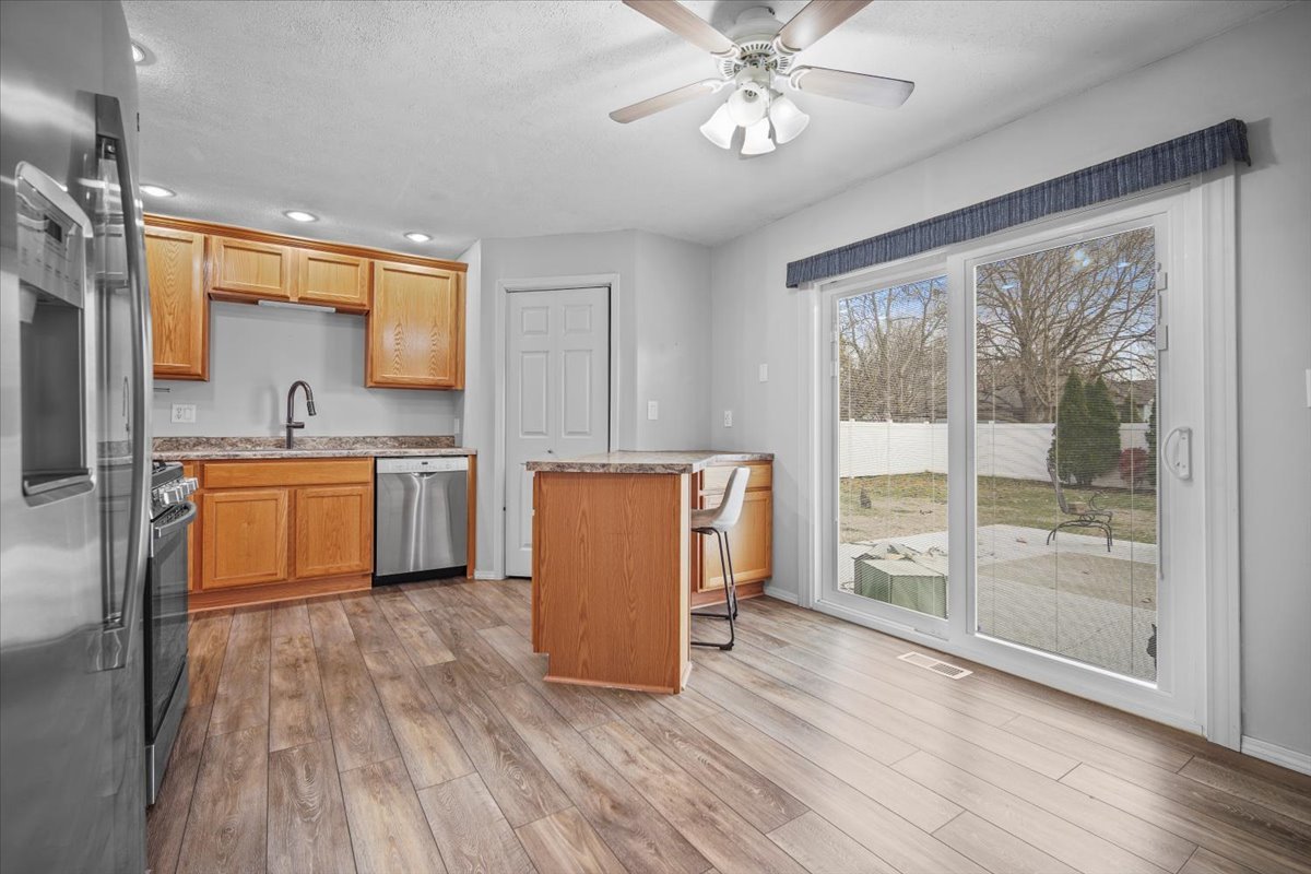 1303 Dalton Drive Normal, IL 61761 - Photo 11 of 20 a view of a kitchen with a sink cabinets and wooden floor