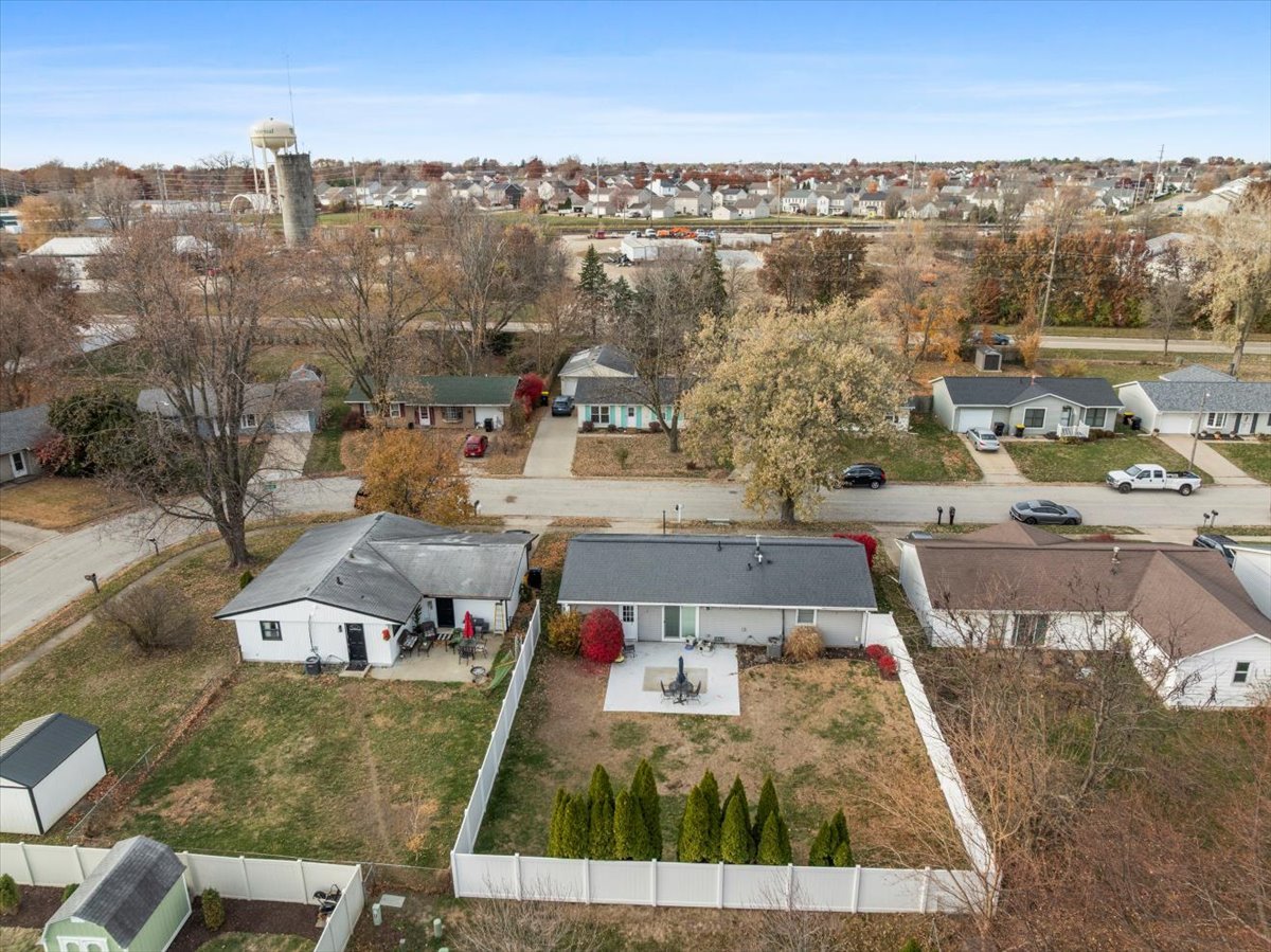1303 Dalton Drive Normal, IL 61761 - Photo 3 of 20 a view of a city with tall buildings