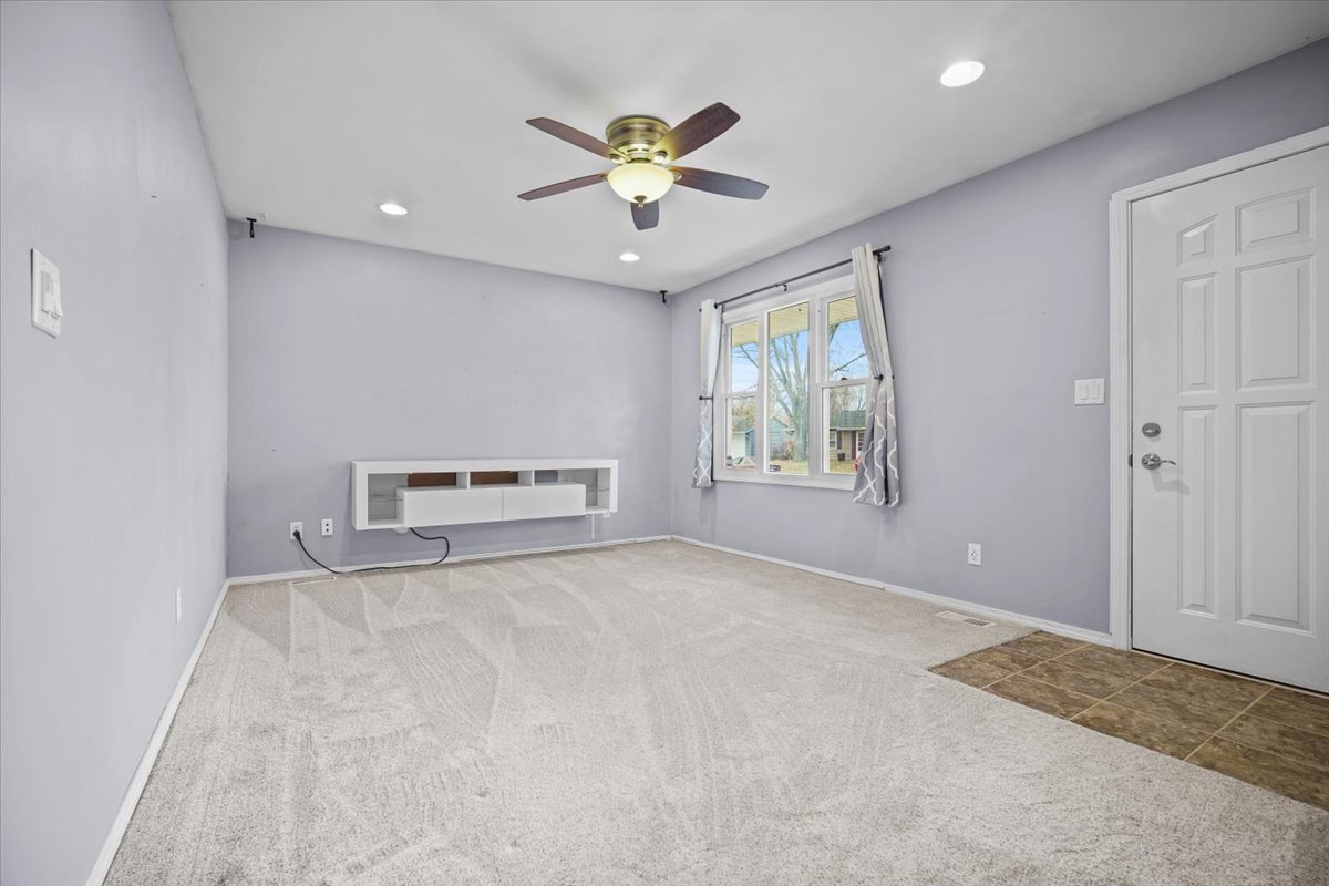 1303 Dalton Drive Normal, IL 61761 - Photo 8 of 20 a view of an empty room with a window