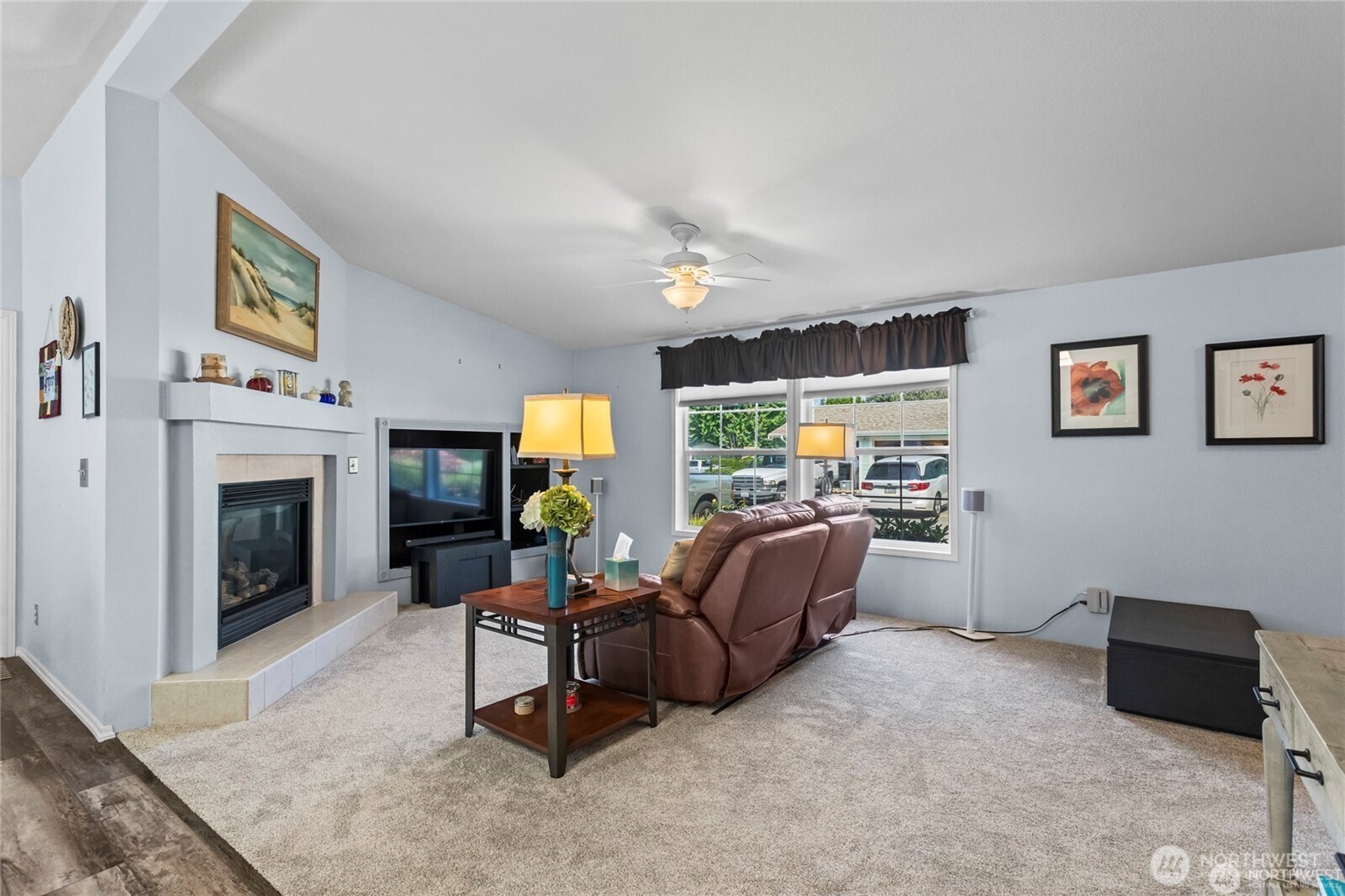 6719 241st Avenue East, Unit 46 Buckley, WA 98321 - Photo 12 of 35 a living room with furniture and a fireplace