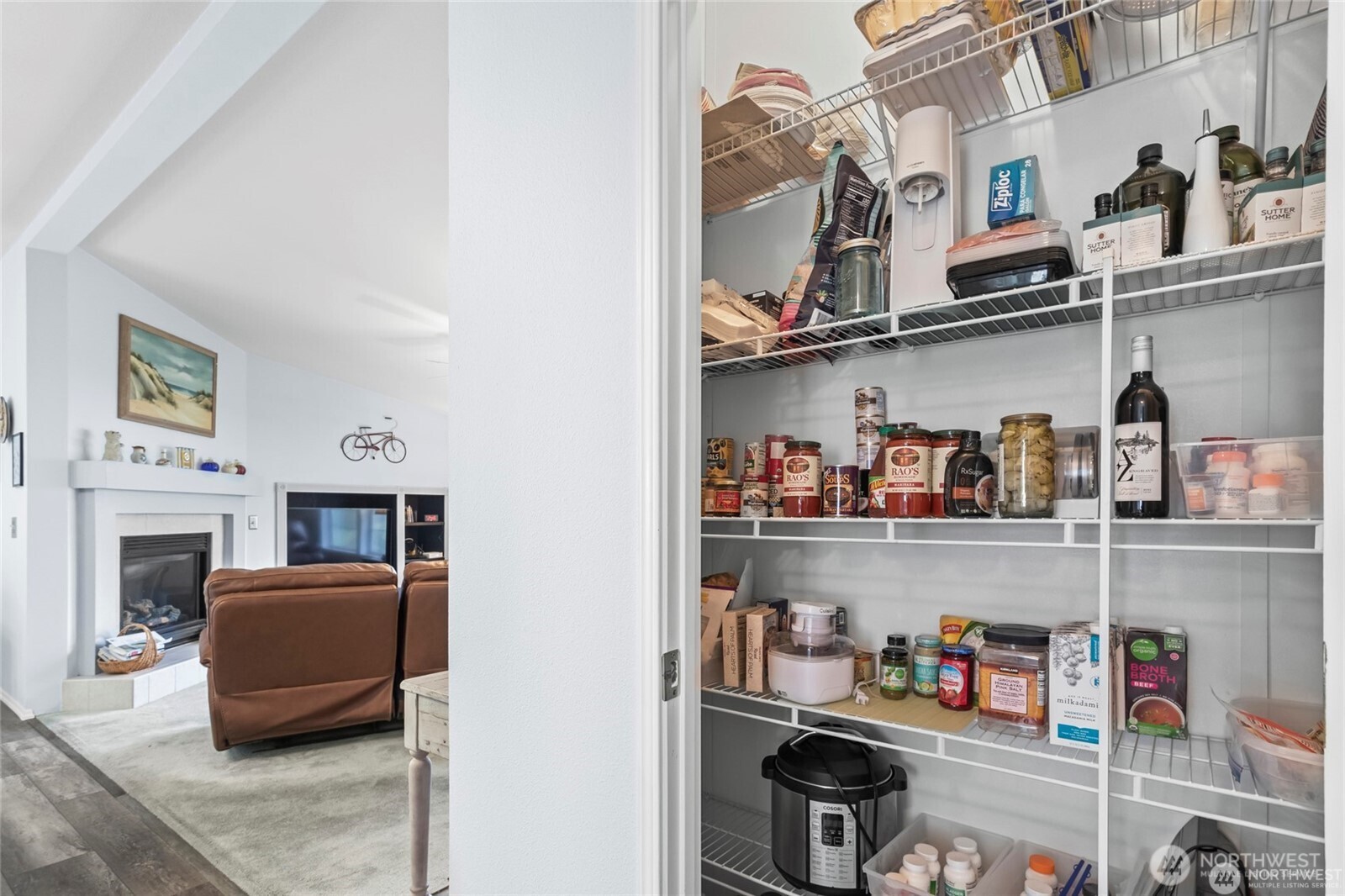 6719 241st Avenue East, Unit 46 Buckley, WA 98321 - Photo 13 of 35 a living room with lots of furniture and a fireplace