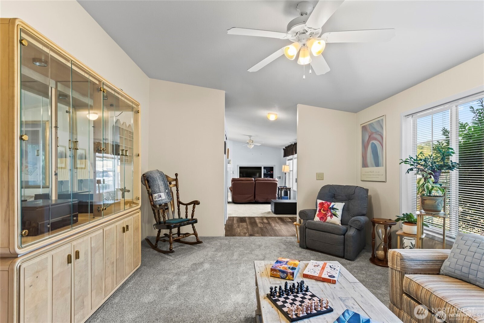 6719 241st Avenue East, Unit 46 Buckley, WA 98321 - Photo 16 of 35 a living room with furniture and a chandelier
