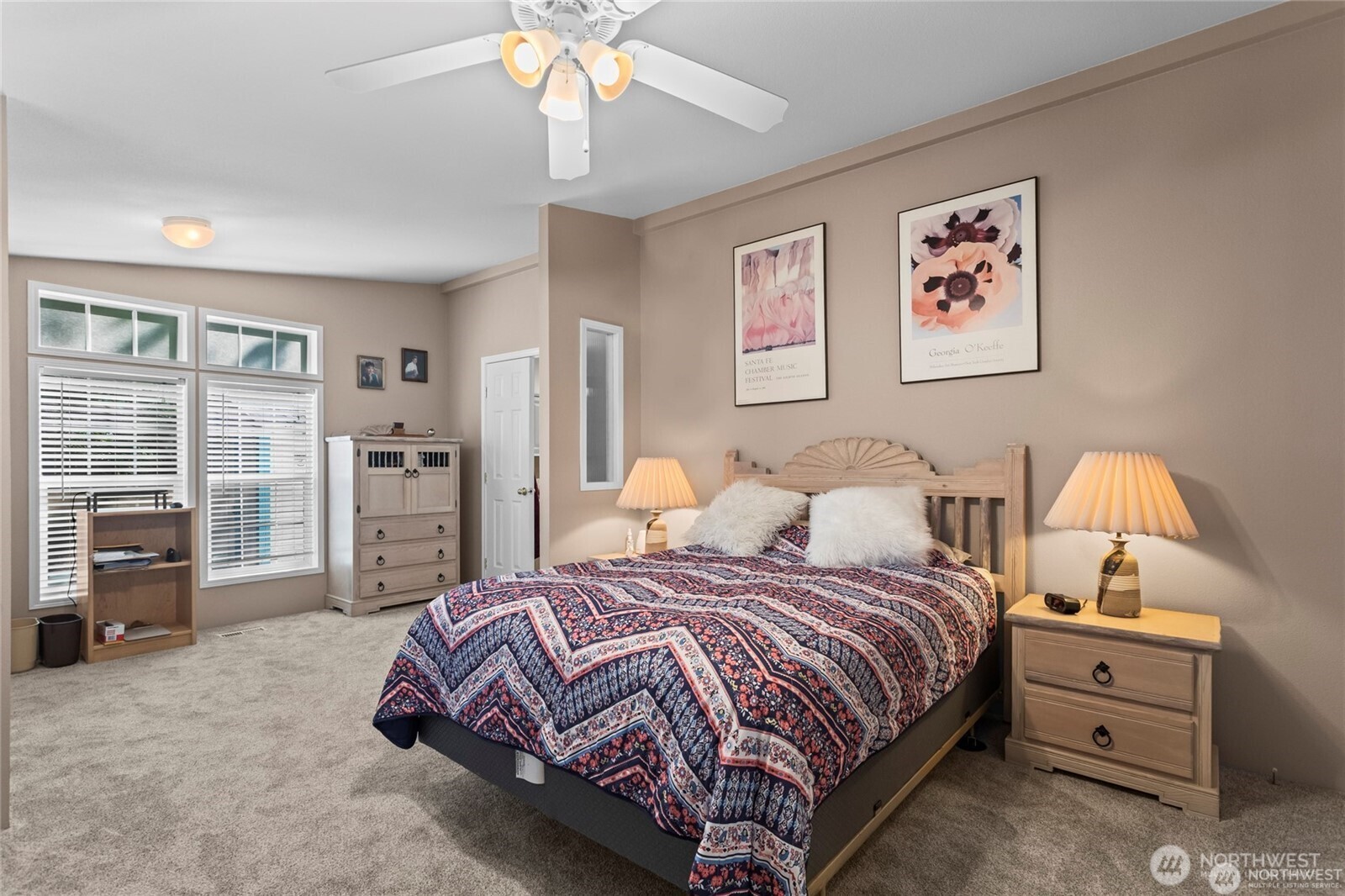 6719 241st Avenue East, Unit 46 Buckley, WA 98321 - Photo 17 of 35 a bedroom with a bed and a chandelier