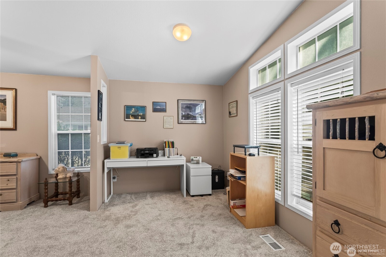 6719 241st Avenue East, Unit 46 Buckley, WA 98321 - Photo 19 of 35 a view of a workspace with furniture and a window