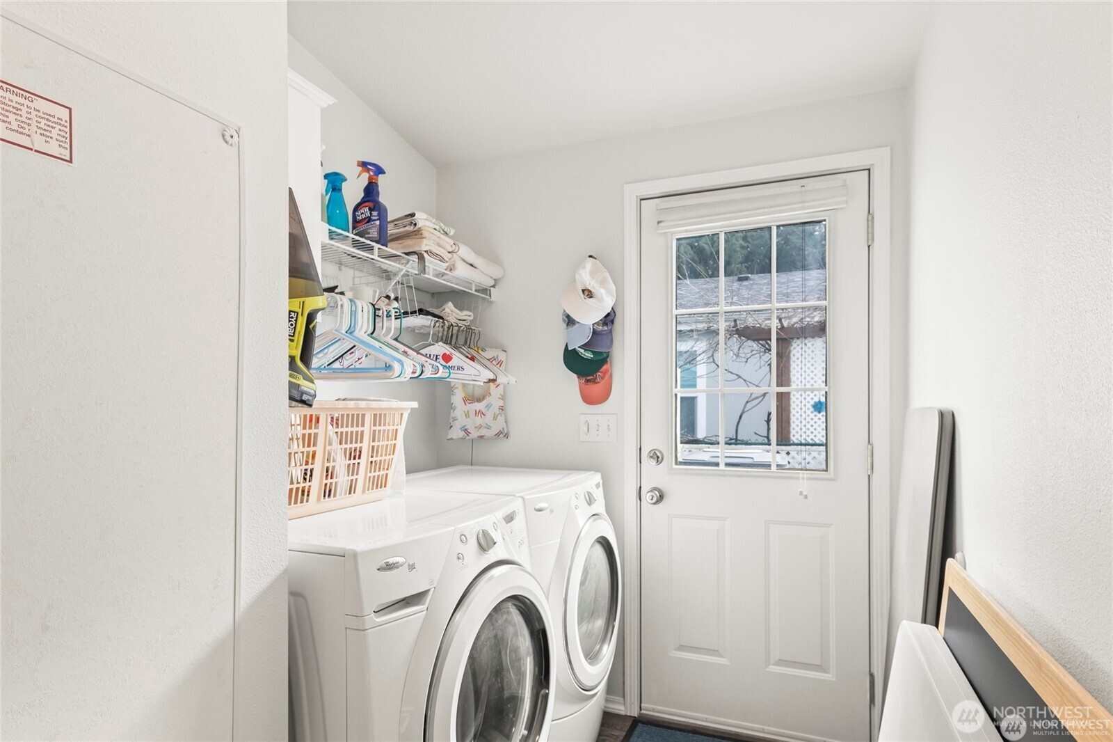 6719 241st Avenue East, Unit 46 Buckley, WA 98321 - Photo 26 of 35 a view of washer and dryer with kitchen in the background