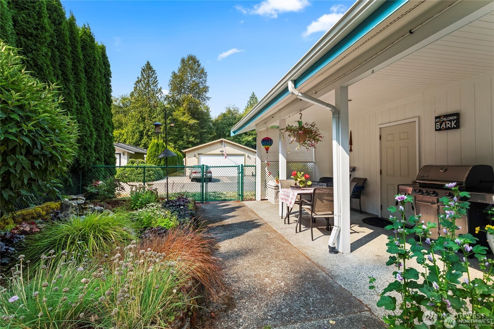 6719 241st Avenue East, Unit 46 Buckley, WA 98321 - Photo 29 of 35 a front view of a house with garden