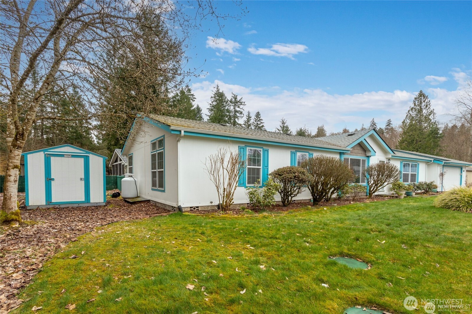 6719 241st Avenue East, Unit 46 Buckley, WA 98321 - Photo 33 of 35 a front view of a house with yard and green space