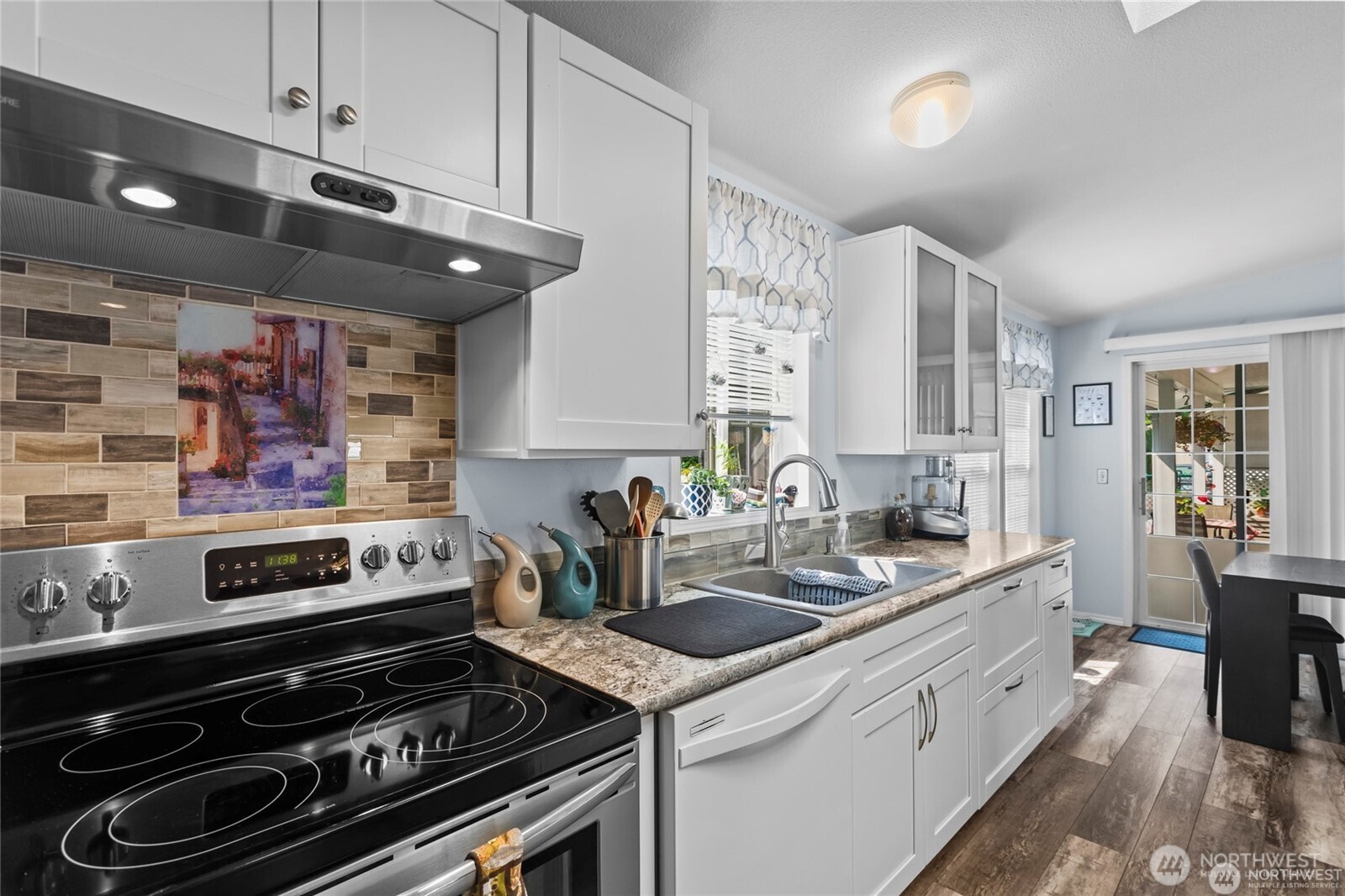 6719 241st Avenue East, Unit 46 Buckley, WA 98321 - Photo 5 of 35 a kitchen with a stove and a sink