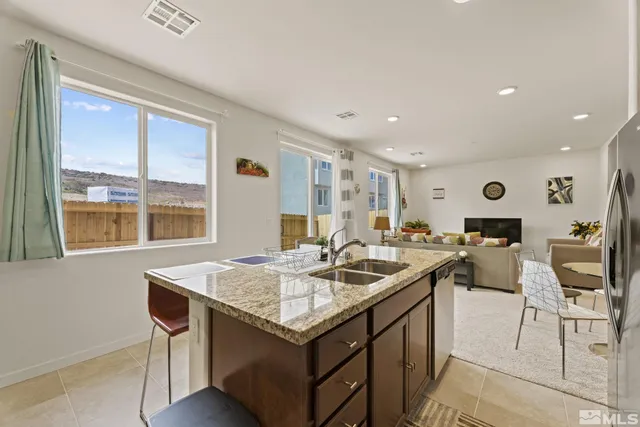 a kitchen with a stove a sink and a refrigerator