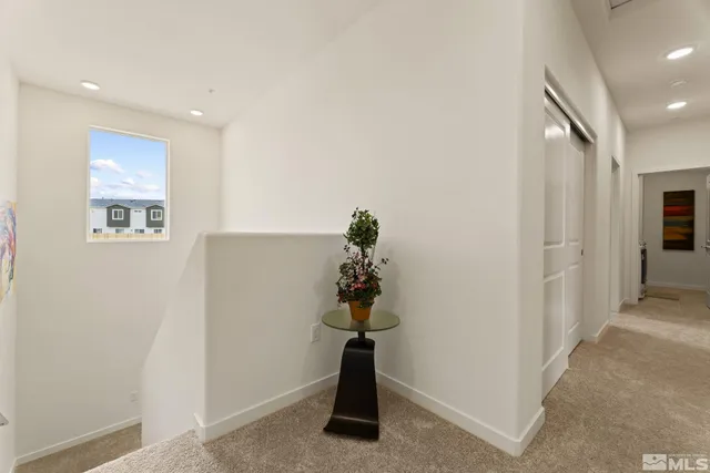 a bedroom with a bed and a table