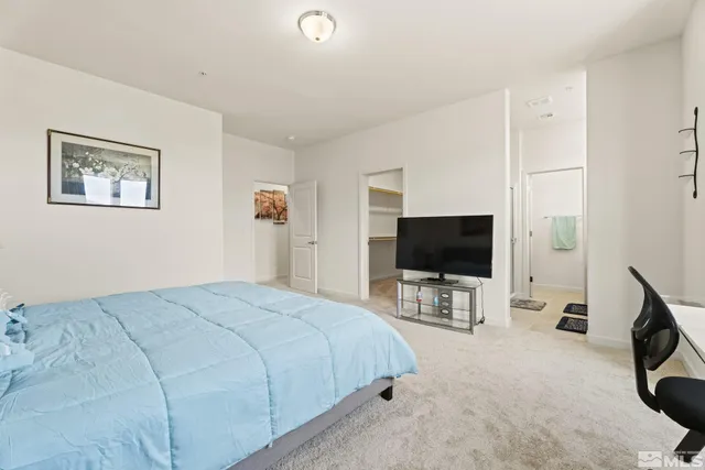 a bathroom with a sink a mirror and shower