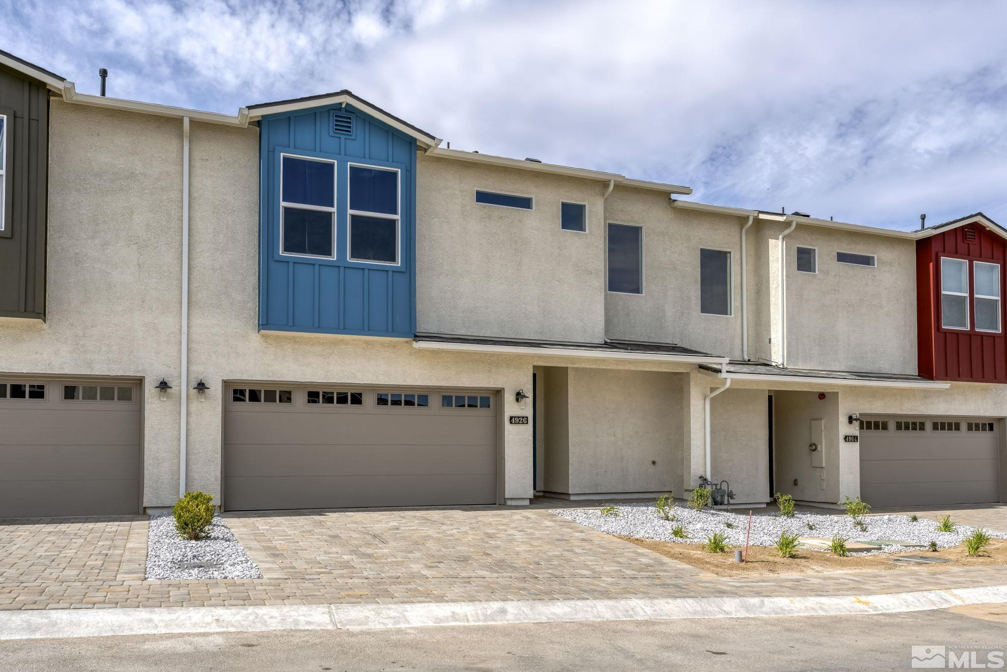 4920 Little Rock Way Sun Valley, NV 89433 - Photo 2 of 37 a front view of a house with a yard