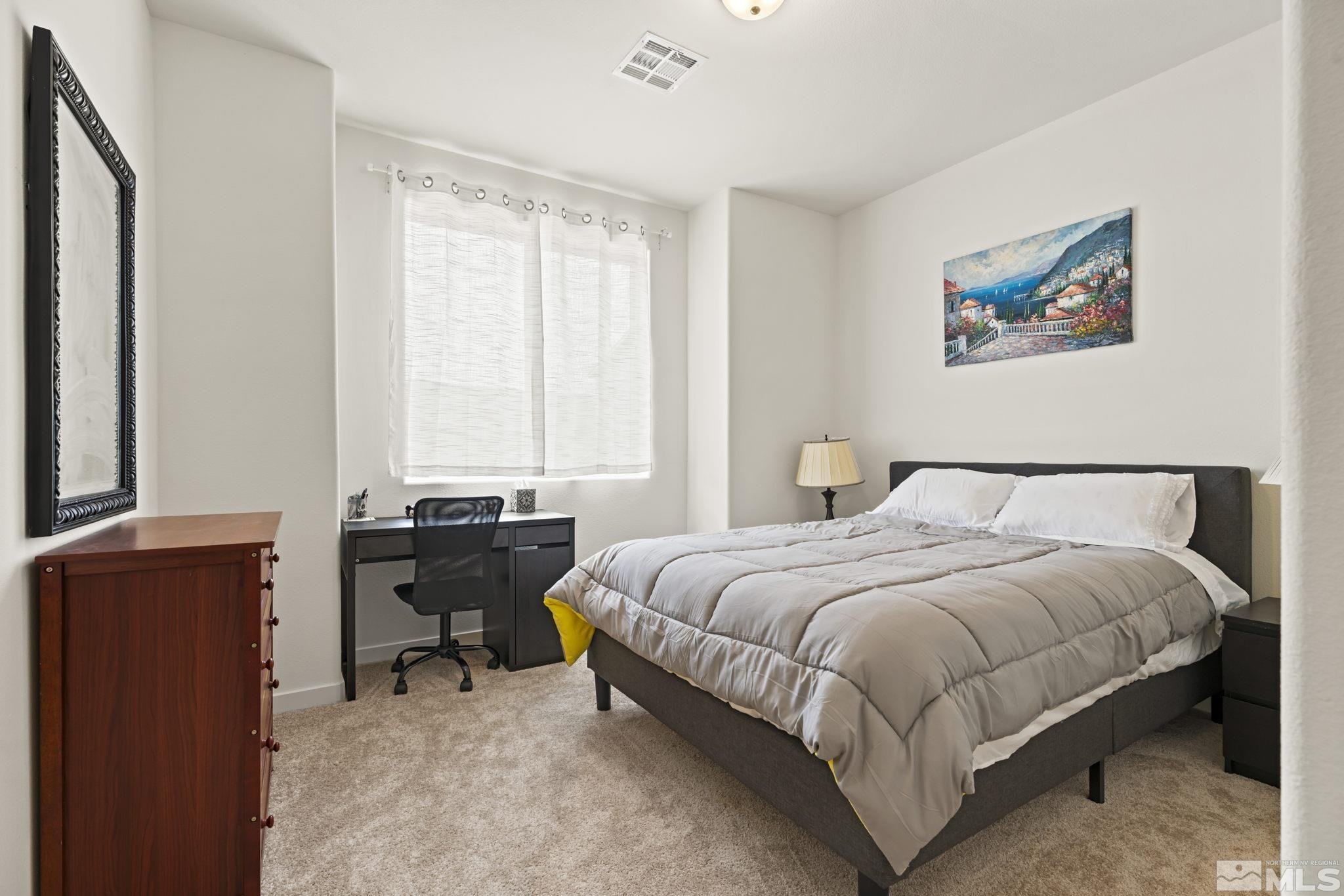 4920 Little Rock Way Sun Valley, NV 89433 - Photo 24 of 37 a bedroom with a bed and a window