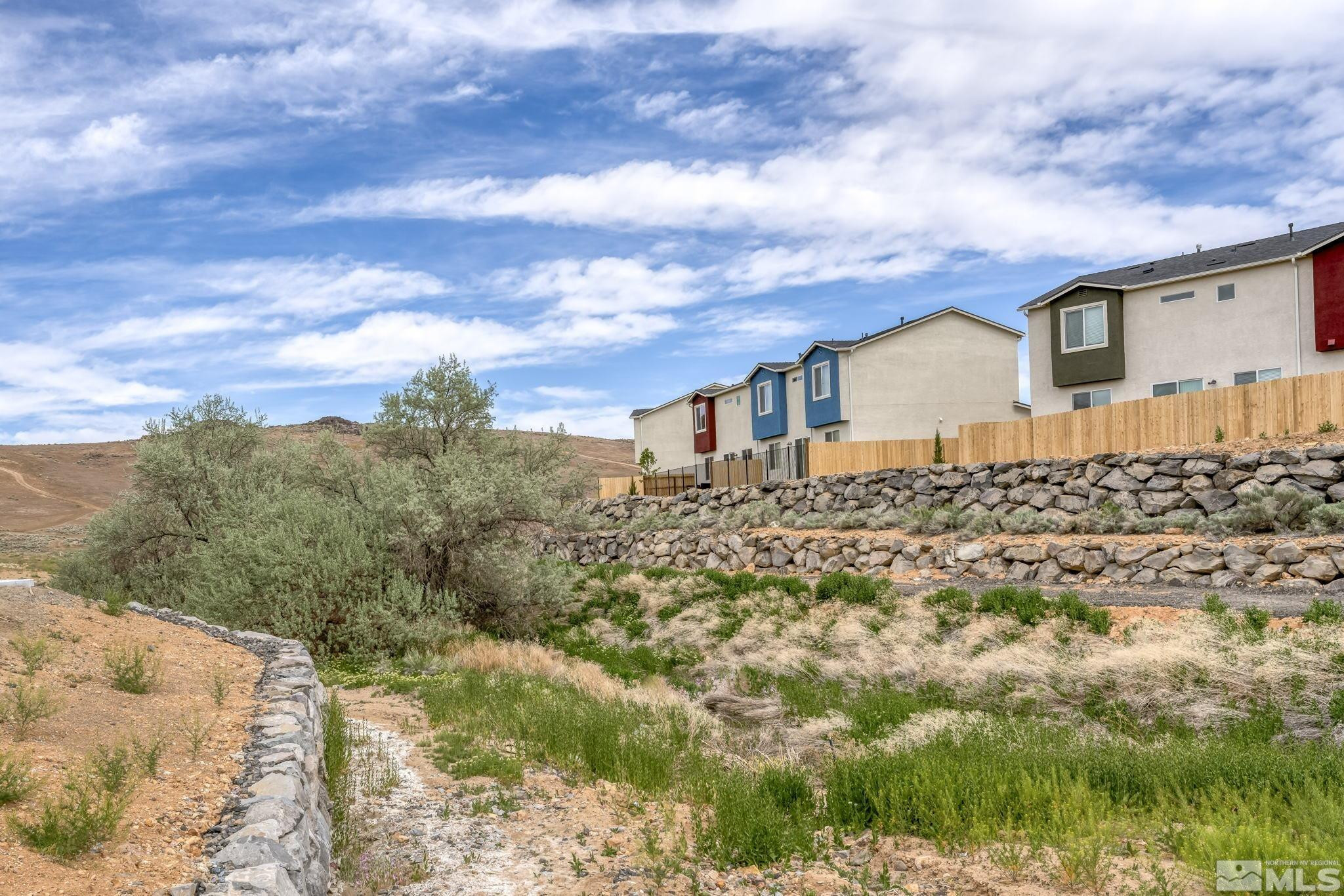 4920 Little Rock Way Sun Valley, NV 89433 - Photo 33 of 37 a view of a house with a yard
