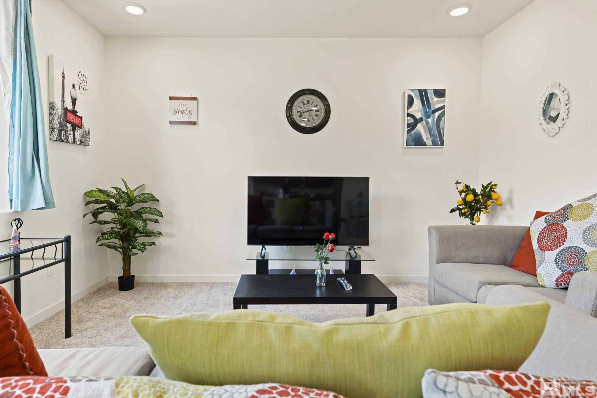4920 Little Rock Way Sun Valley, NV 89433 - Photo 7 of 37 a living room with furniture and a flat screen tv