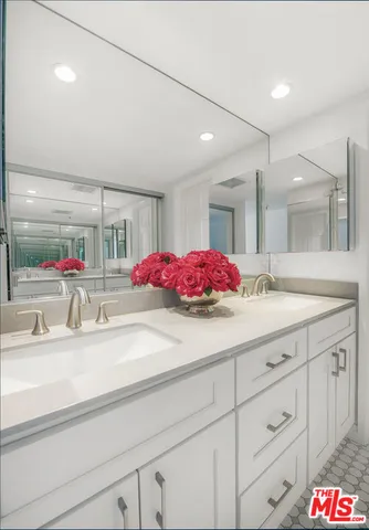 a front view of a house with a potted plant