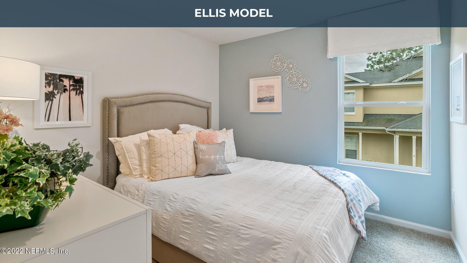 8368 Retrograde Road Jacksonville, FL 32256 - Photo 11 of 25 a bedroom with a bed and a potted plant