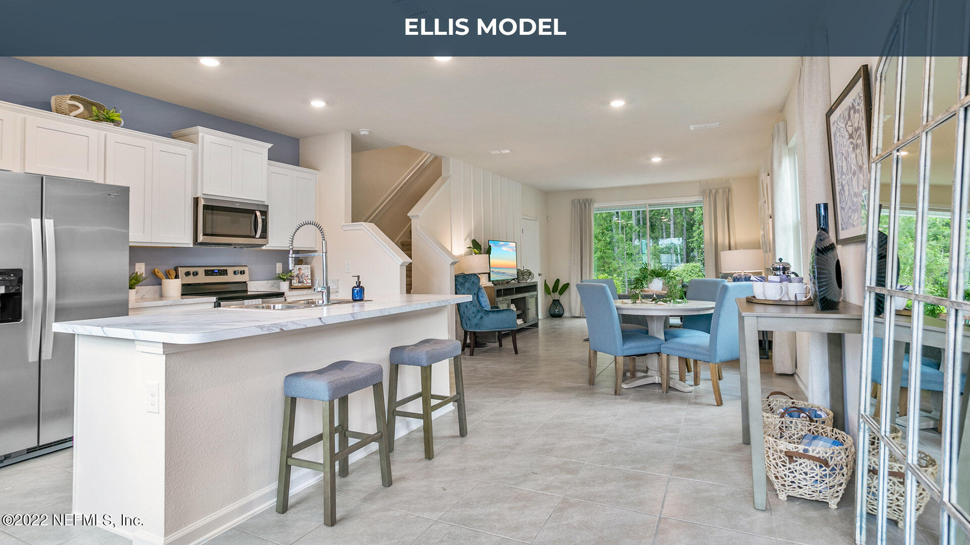 8368 Retrograde Road Jacksonville, FL 32256 - Photo 5 of 25 a kitchen with stainless steel appliances a refrigerator and a dining table