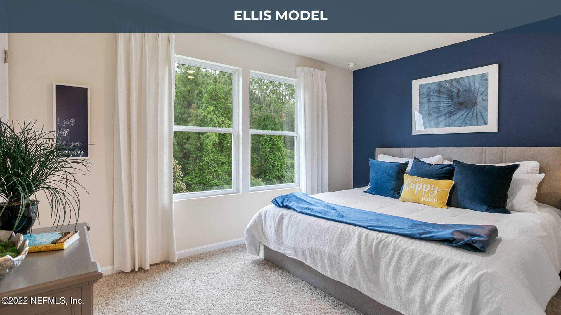 8368 Retrograde Road Jacksonville, FL 32256 - Photo 9 of 25 a bedroom with a large bed and a window