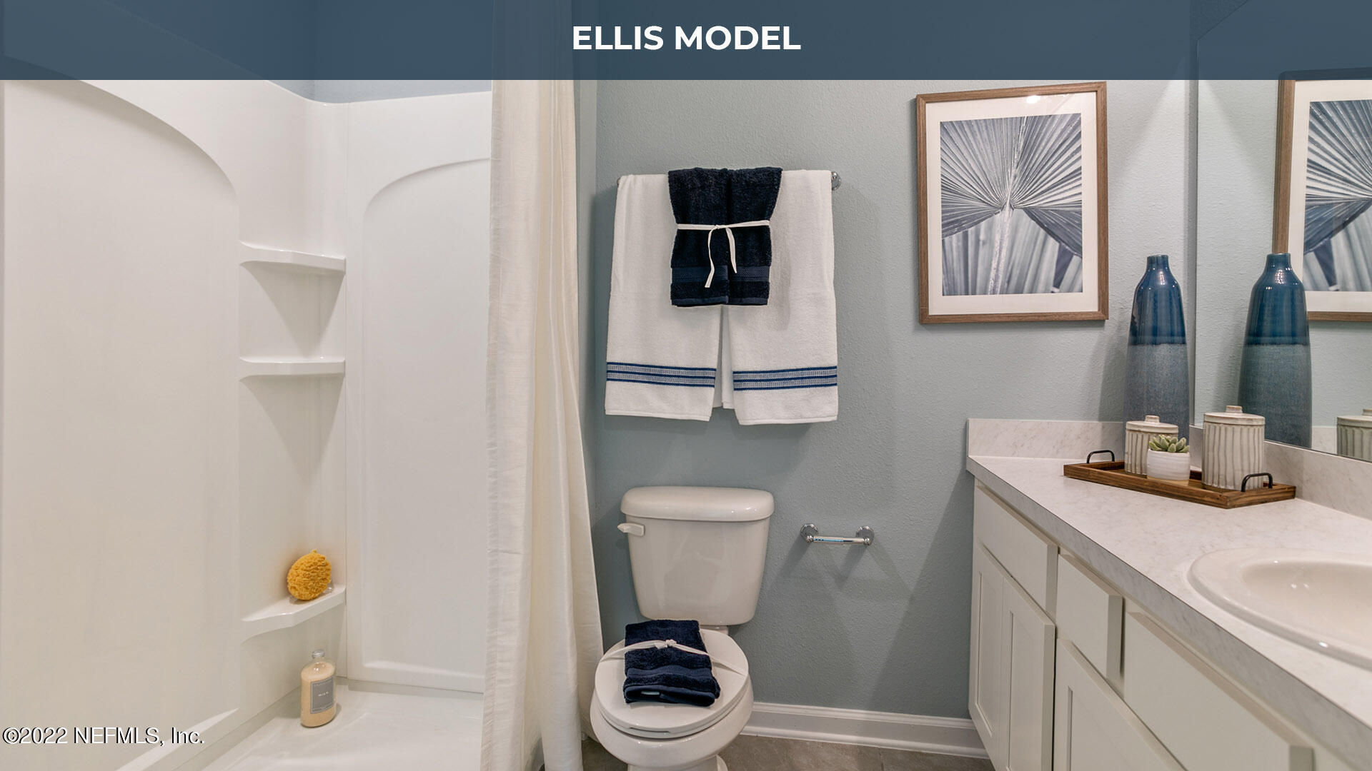 8368 Retrograde Road Jacksonville, FL 32256 - Photo 10 of 25 a bathroom with a toilet a sink and mirror