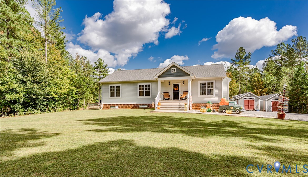 915 Manchester Road Bumpass, VA 23024 - Photo 1 of 49 a view of a house with a swimming pool